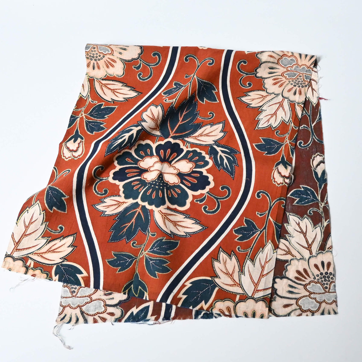 Vintage Japanese Sarasa cotton piece with peony pattern in warm rust orange and navy, inspired by imported chintz designs.