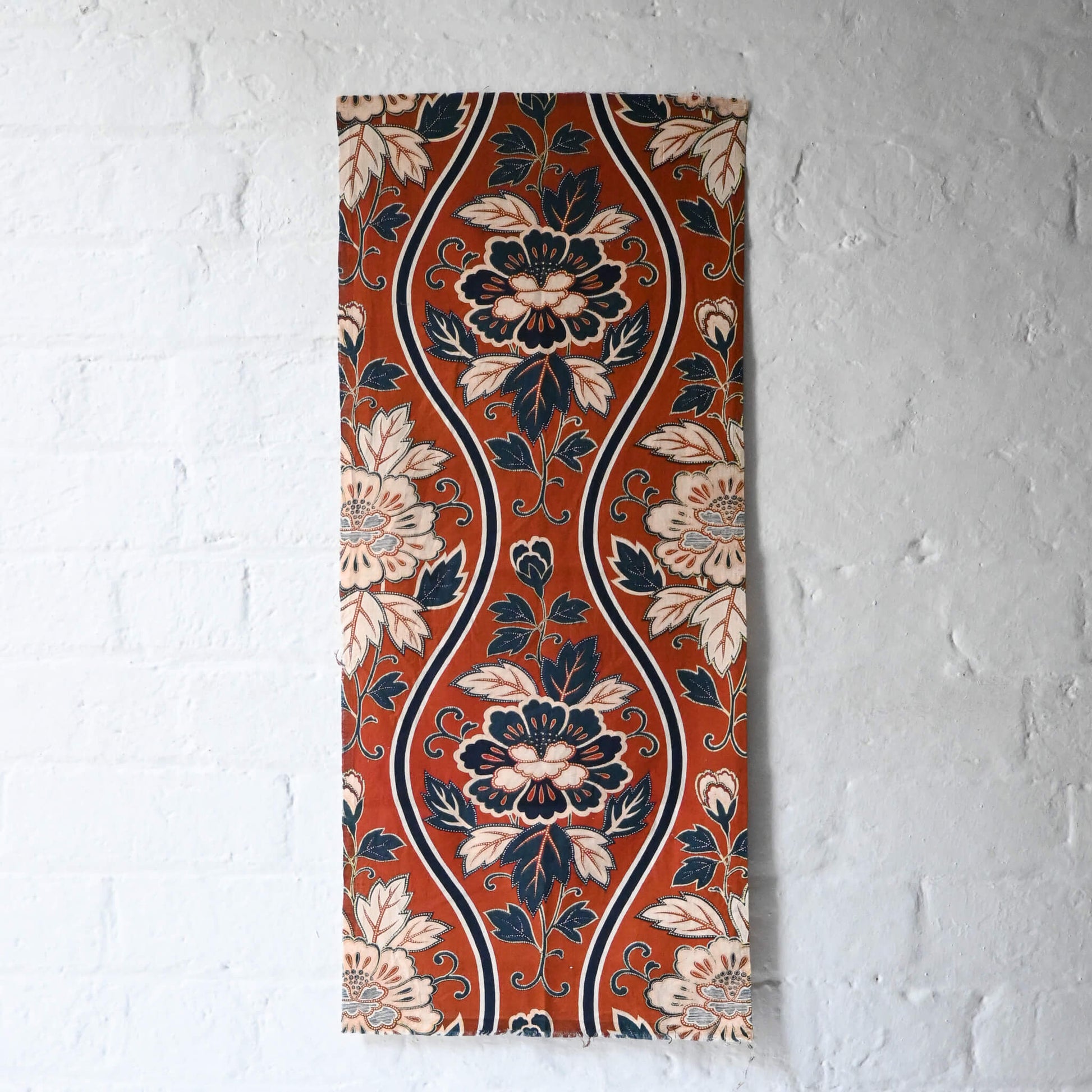 Vintage Japanese Sarasa cotton piece with peony pattern in warm rust orange and navy, inspired by imported chintz designs.