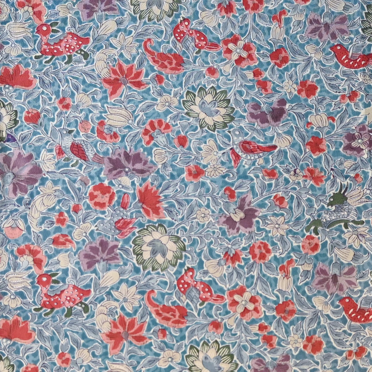 Vintage silk crepe kimono fabric piece with Sarasa floral and bird patten in soft blue.
