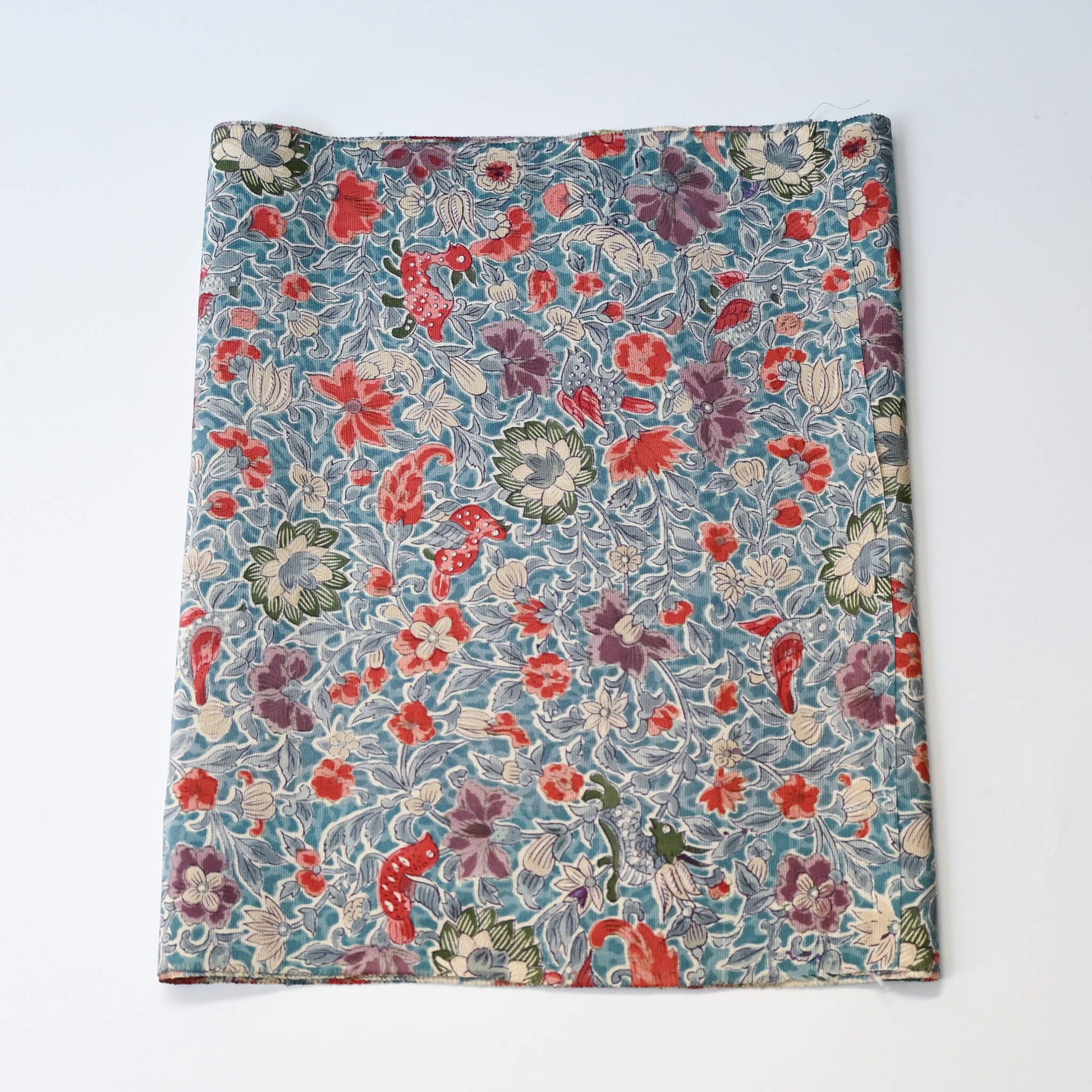 Vintage silk crepe kimono fabric piece with Sarasa floral and bird patten in soft blue.