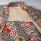 Vintage women's ivory silk crepe haori with an all-over multicoloured Japanese floral pattern.
