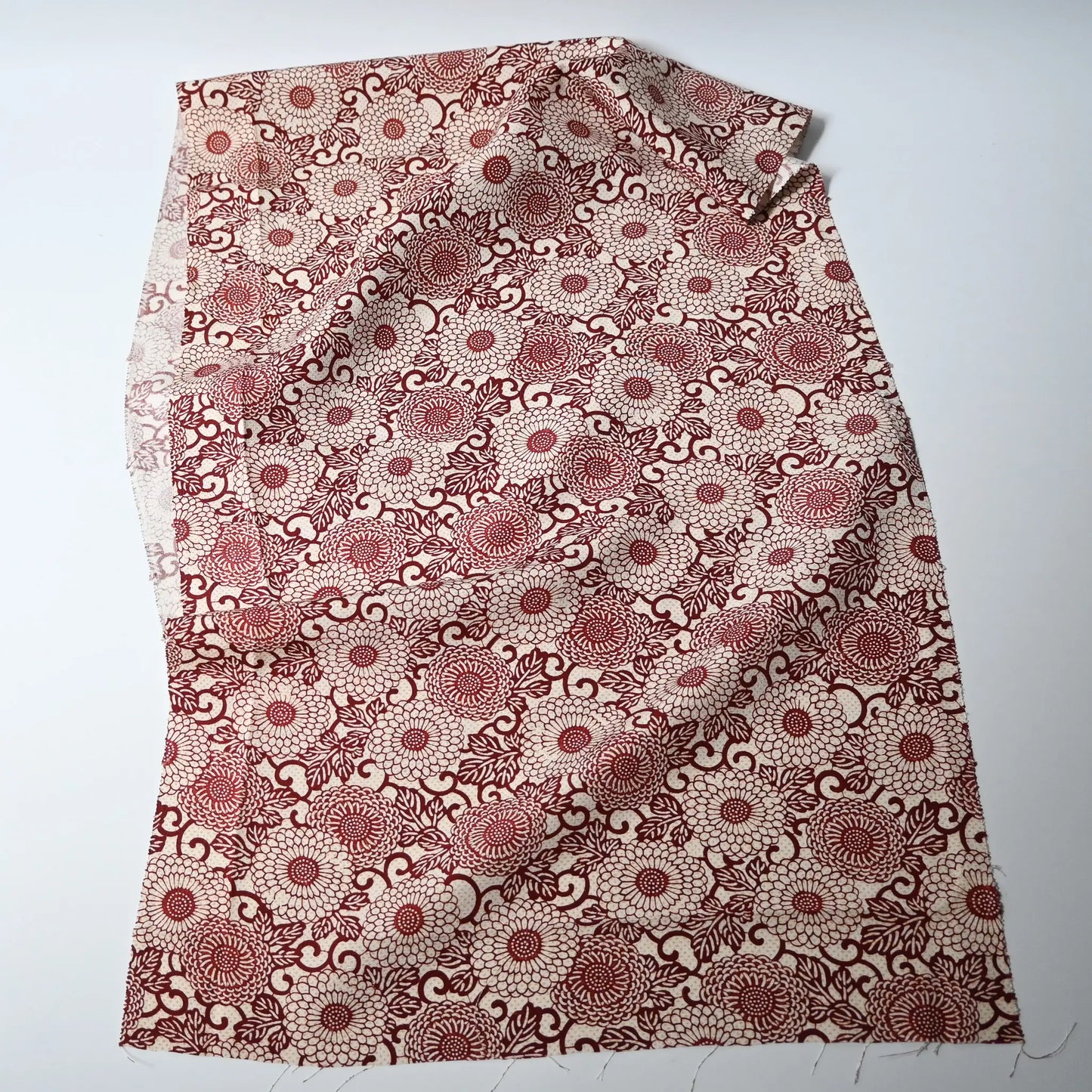 Vintage Japanese silk crepe kimono fabric with chrysanthemum arabesque motif in burgundy red.