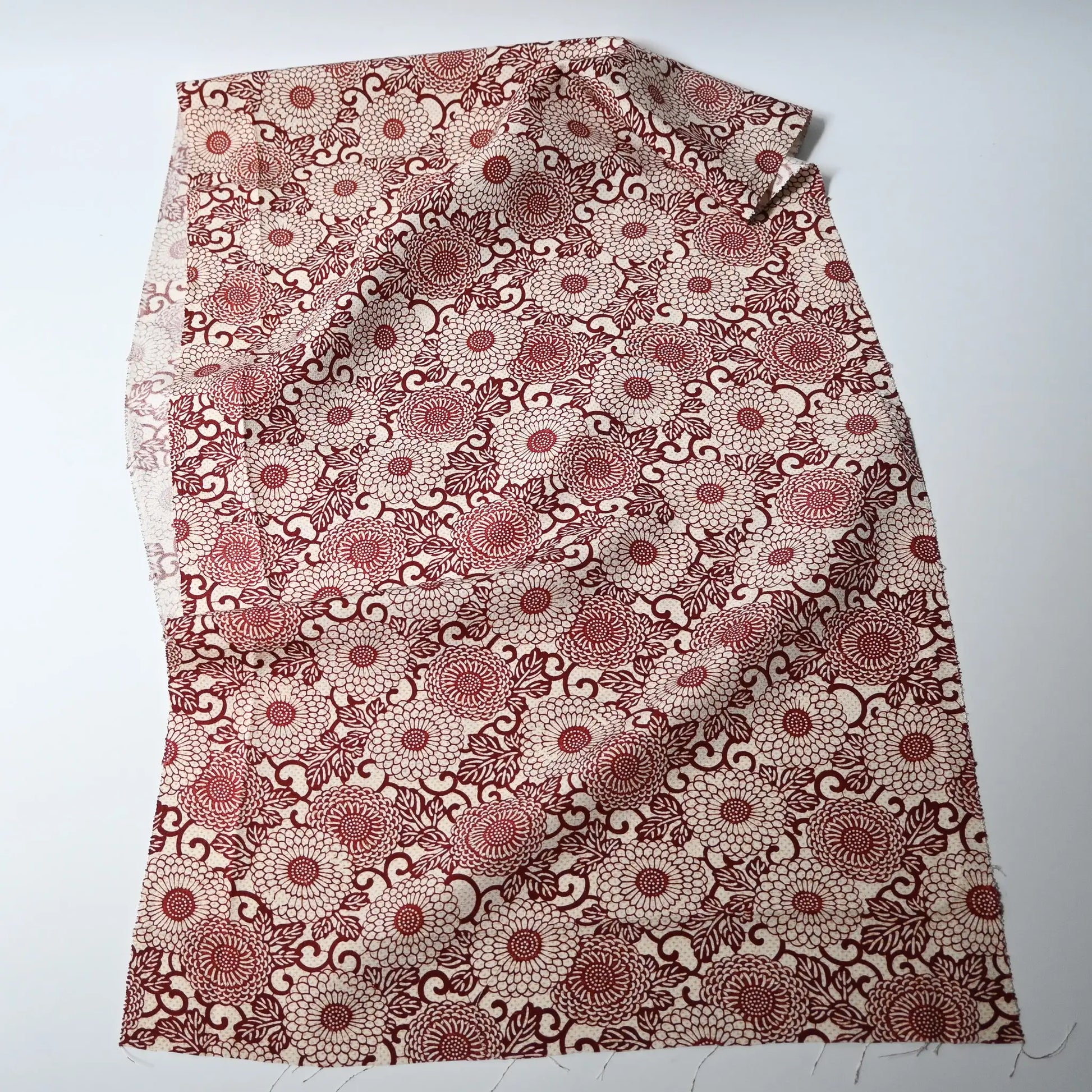 Vintage Japanese silk crepe kimono fabric with chrysanthemum arabesque motif in burgundy red.