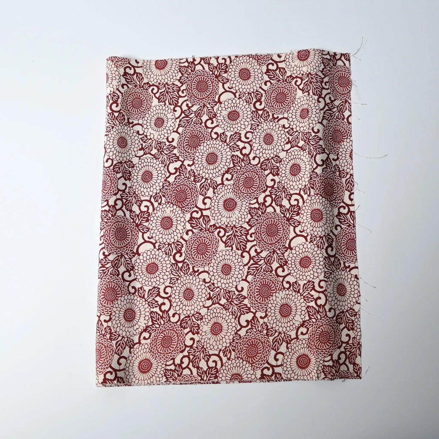 Vintage Japanese silk crepe kimono fabric with chrysanthemum arabesque motif in burgundy red.