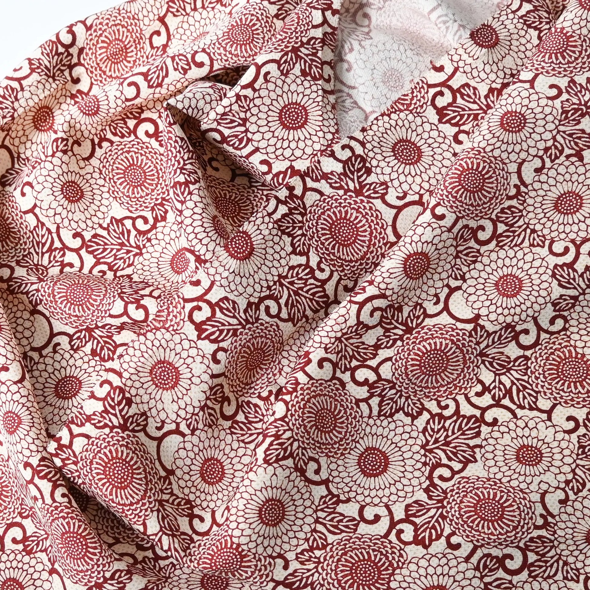 Vintage Japanese silk crepe kimono fabric with chrysanthemum arabesque motif in burgundy red.