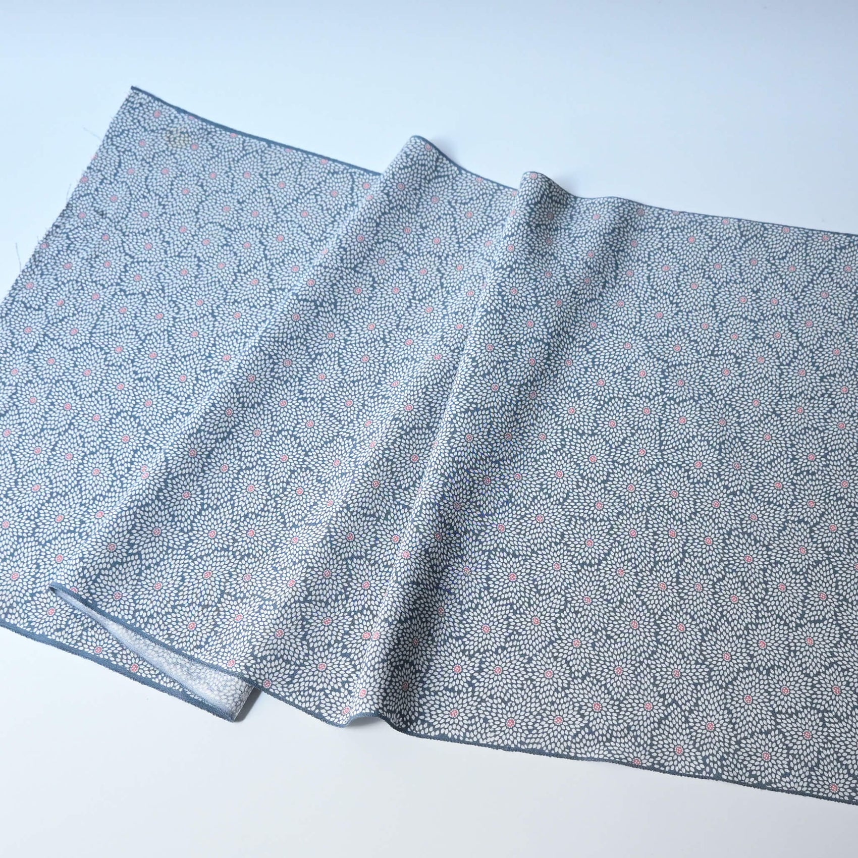 Vintage silk crepe kimono fabric in pale grey-blue with all over chrysanthemum pattern.