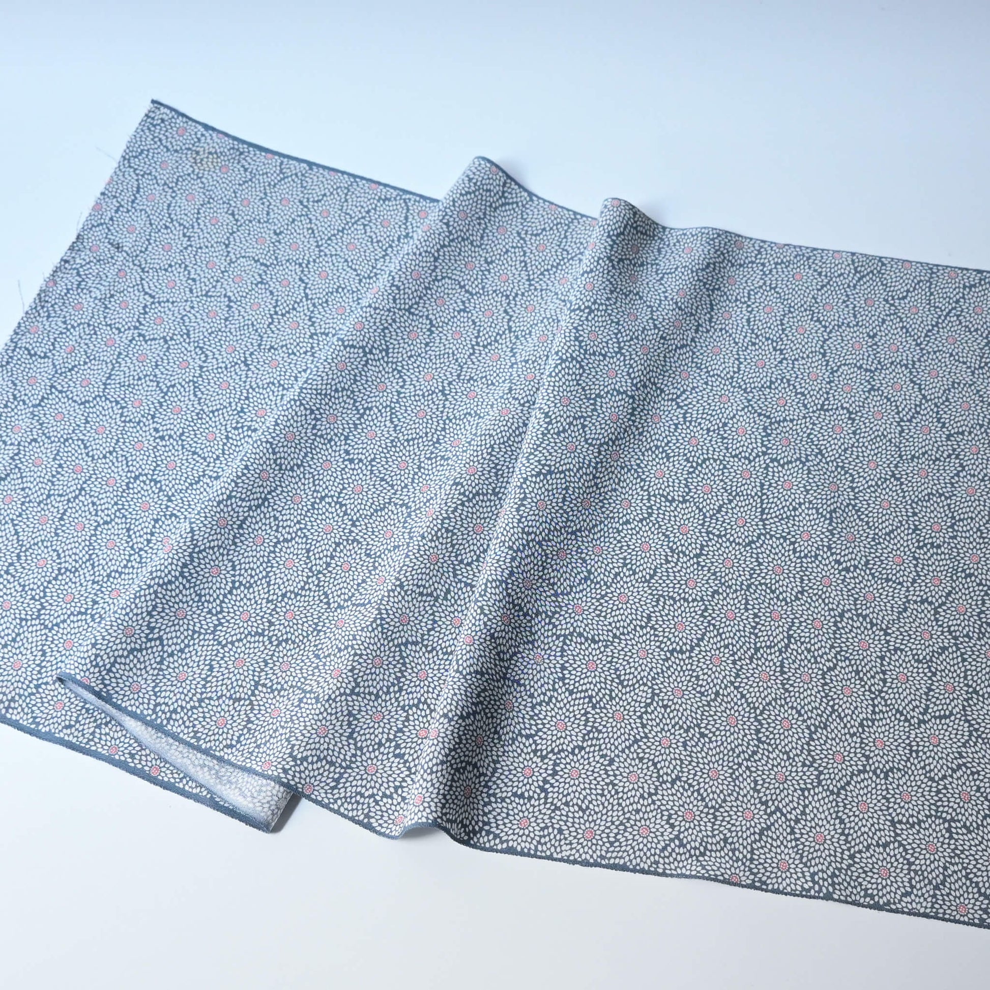 Vintage silk crepe kimono fabric in pale grey-blue with all over chrysanthemum pattern.
