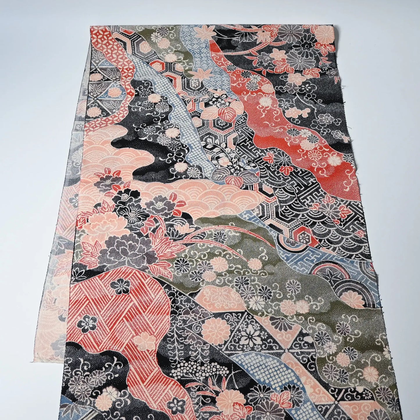 Vintage silk crepe kimono fabric with many traditional Japanese seasonal flowers and auspicious motifs in multiple colours.
