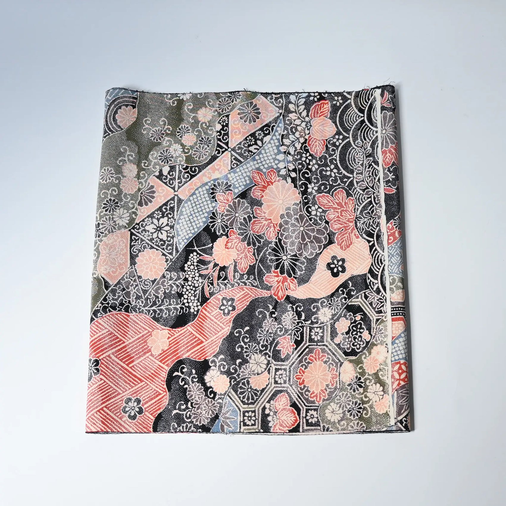 Vintage silk crepe kimono fabric with many traditional Japanese seasonal flowers and auspicious motifs in multiple colours.
