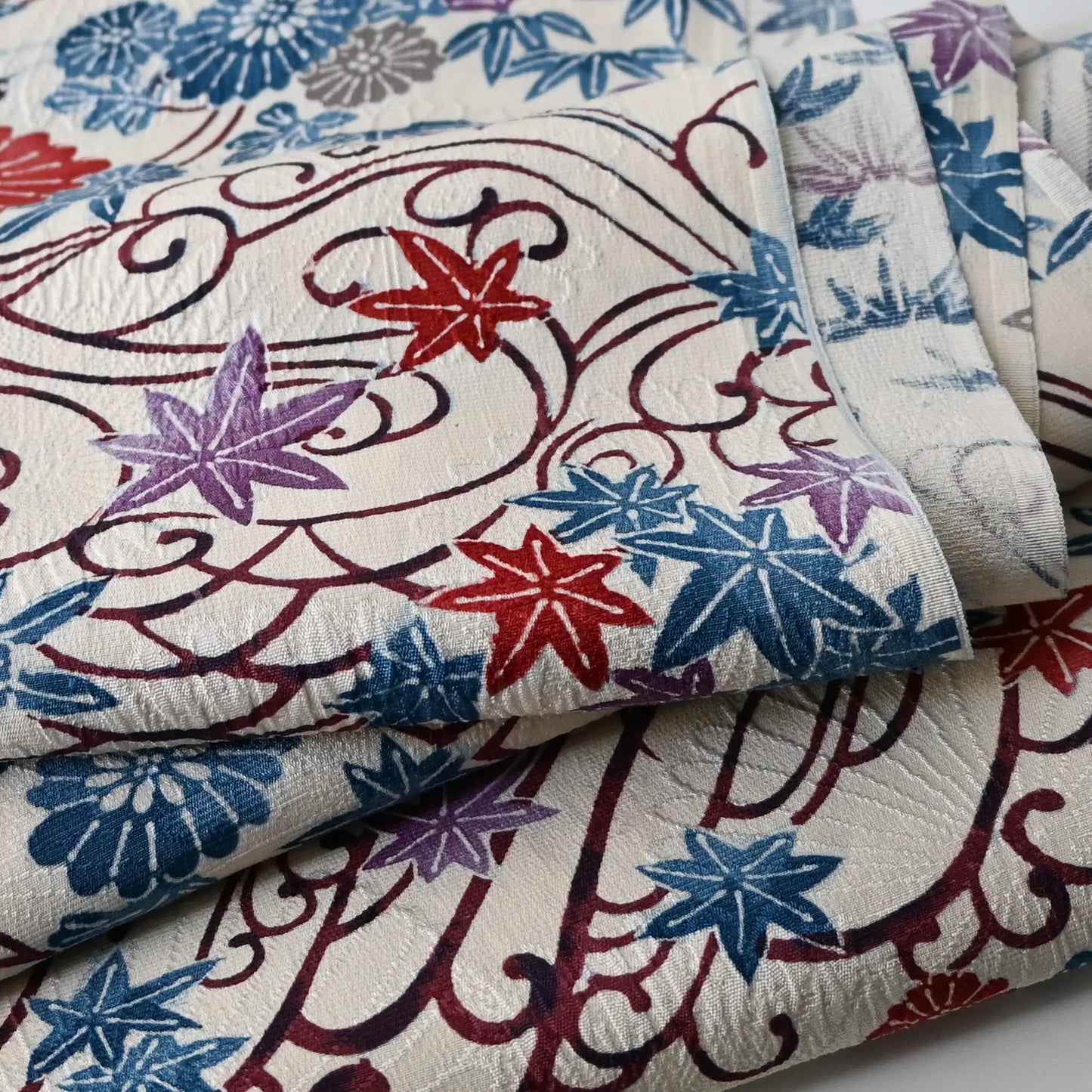 Detailed view of vintage silk jacquard kimono fabric with beautiful texture.