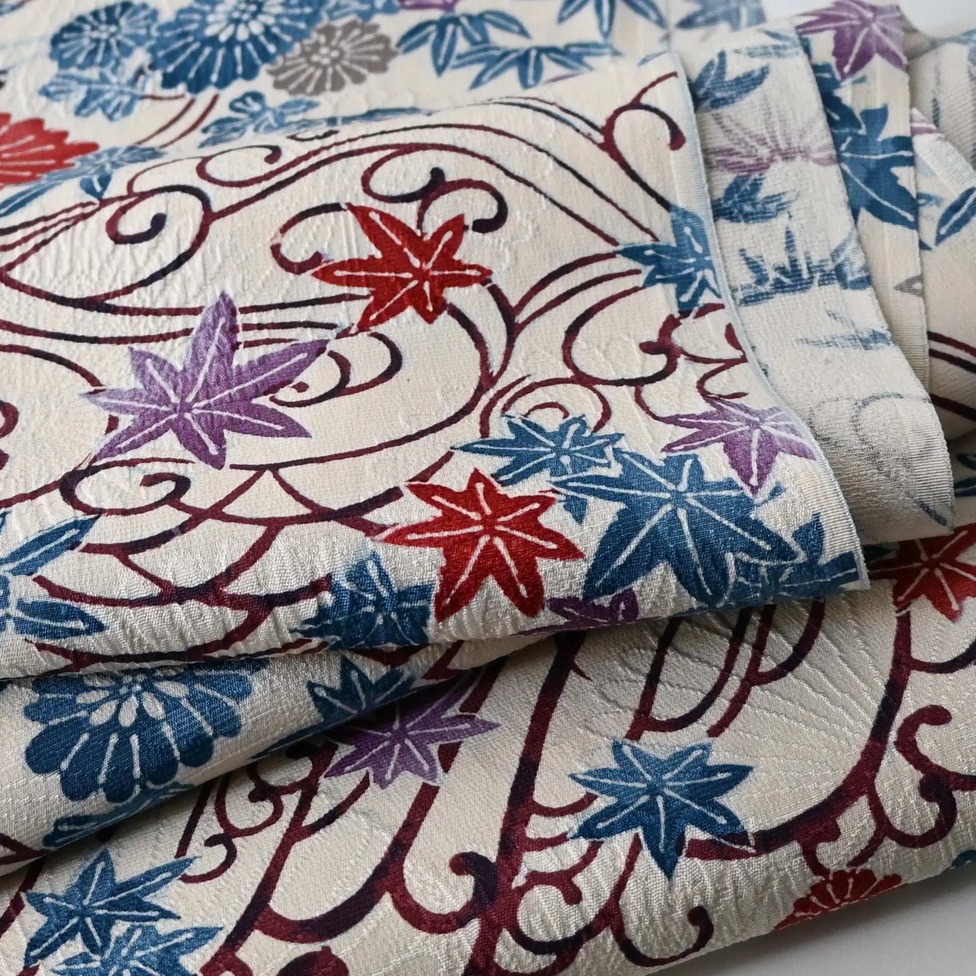 Detailed view of vintage silk jacquard kimono fabric with beautiful texture.