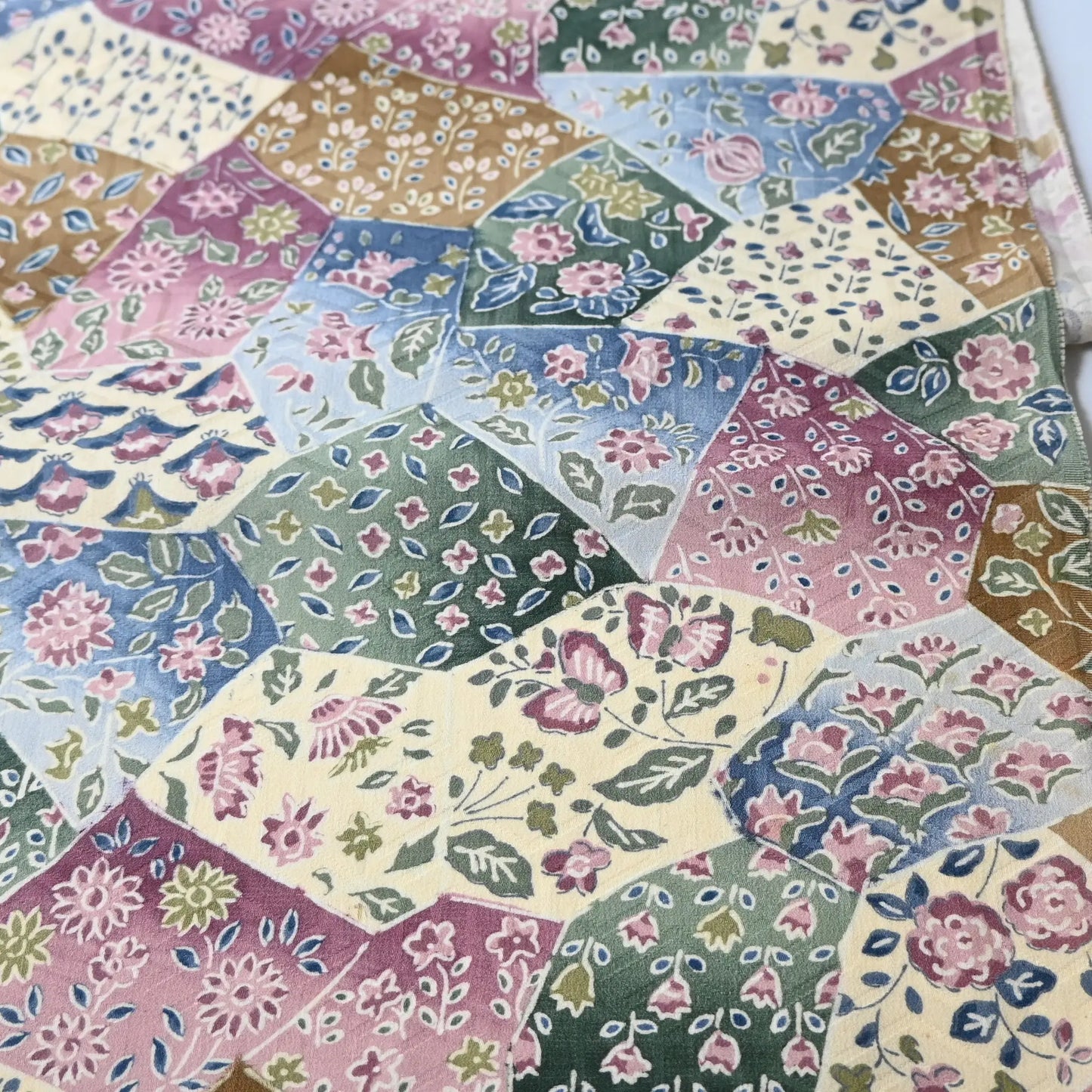 Detailed view of vintage silk Jacquard kimono fabric in pastel colour with gorgeous floral pattern. 