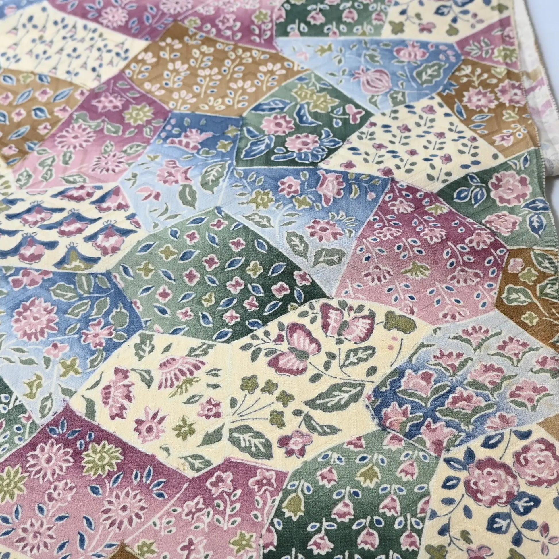 Detailed view of vintage silk Jacquard kimono fabric in pastel colour with gorgeous floral pattern. 