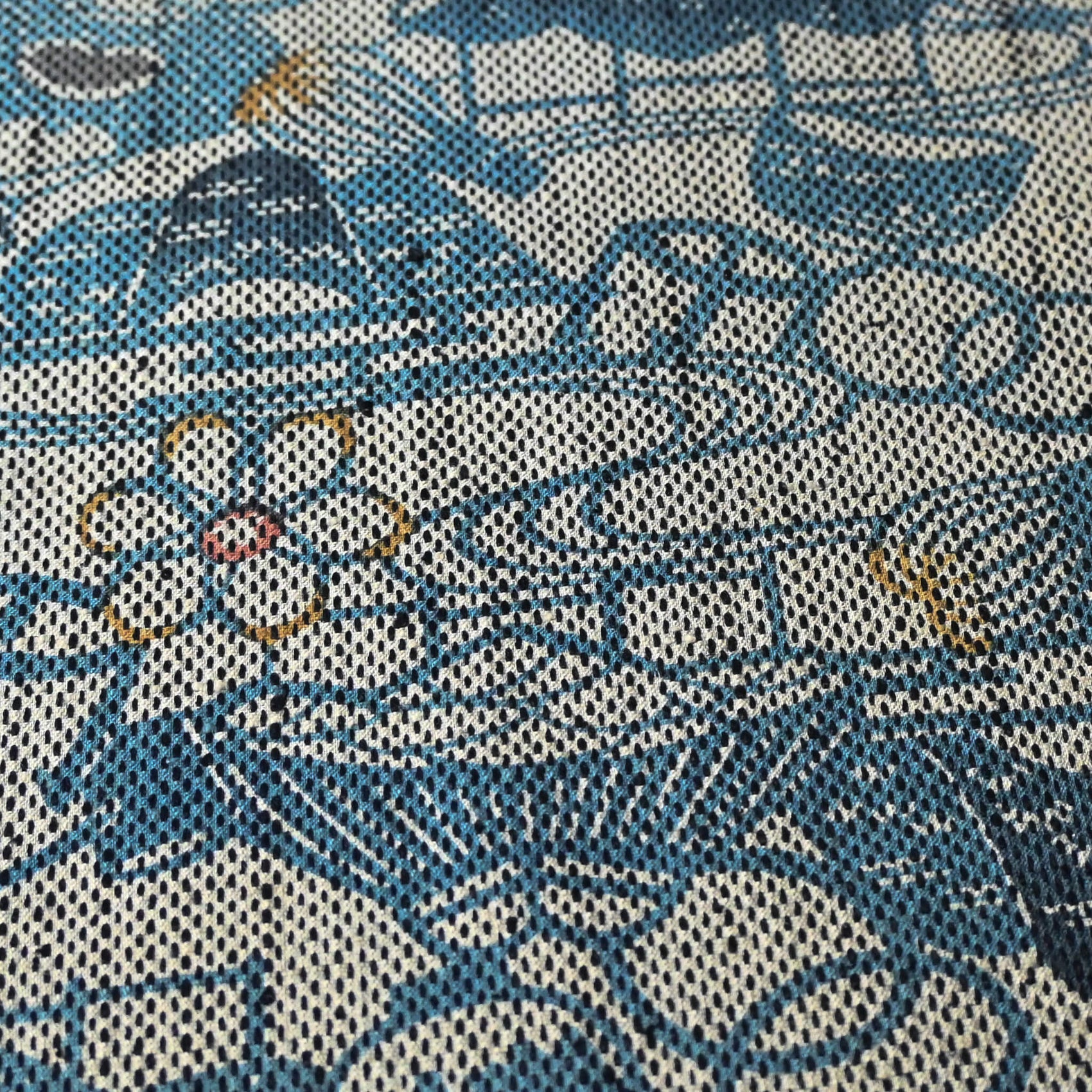 Close-up view of vintage silk kimono fabric piece with katazome dyed tea ceremony utensil motif.