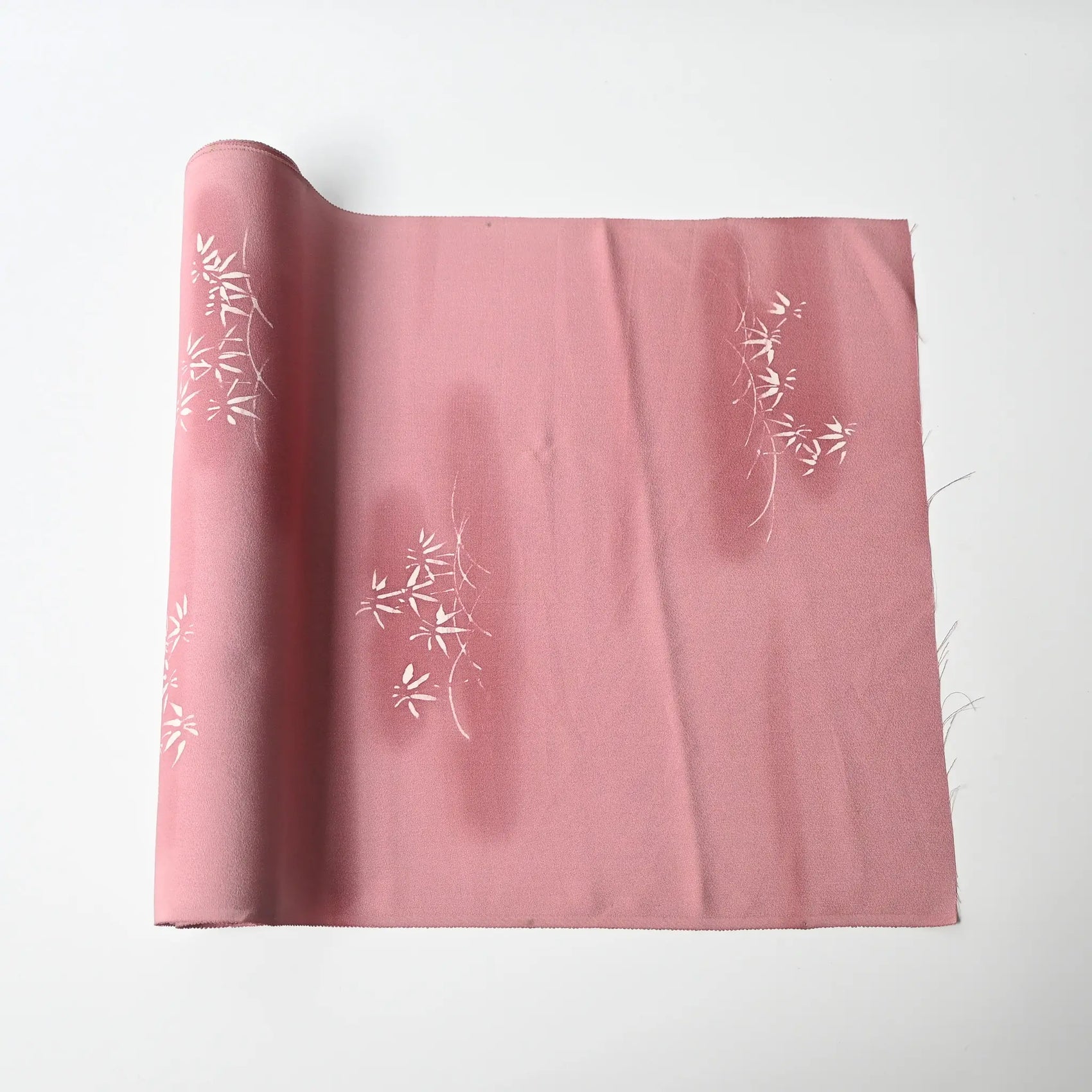 Vintage Japanese silk kimono fabric in pale purple with a pink tone, featuring a bamboo motif.