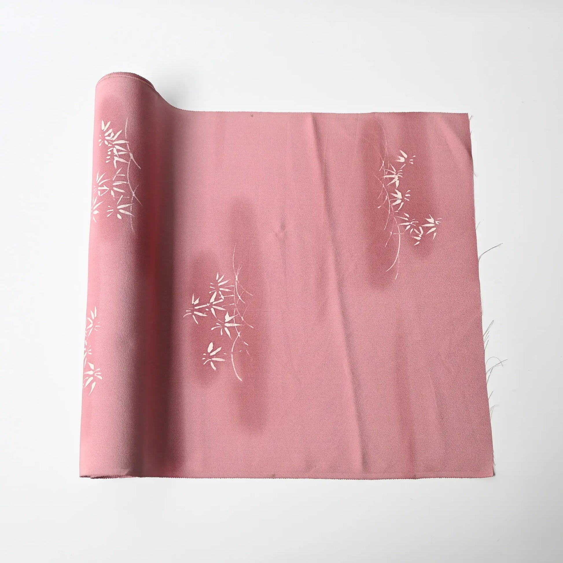 Vintage Japanese silk kimono fabric in pale purple with a pink tone, featuring a bamboo motif.