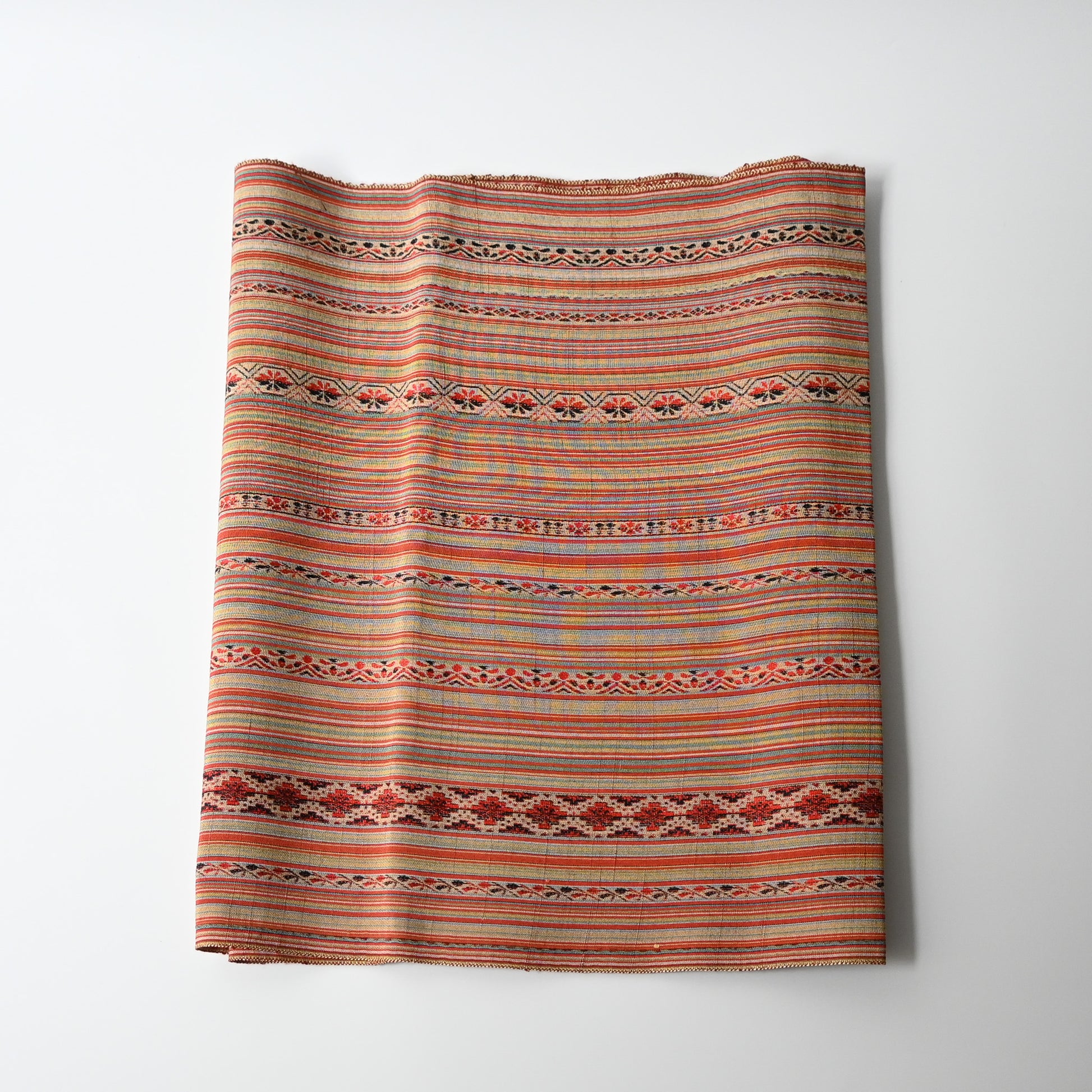 Vintage silk kimono fabric with an unusual pattern, resembling Eastern European folk textiles. 