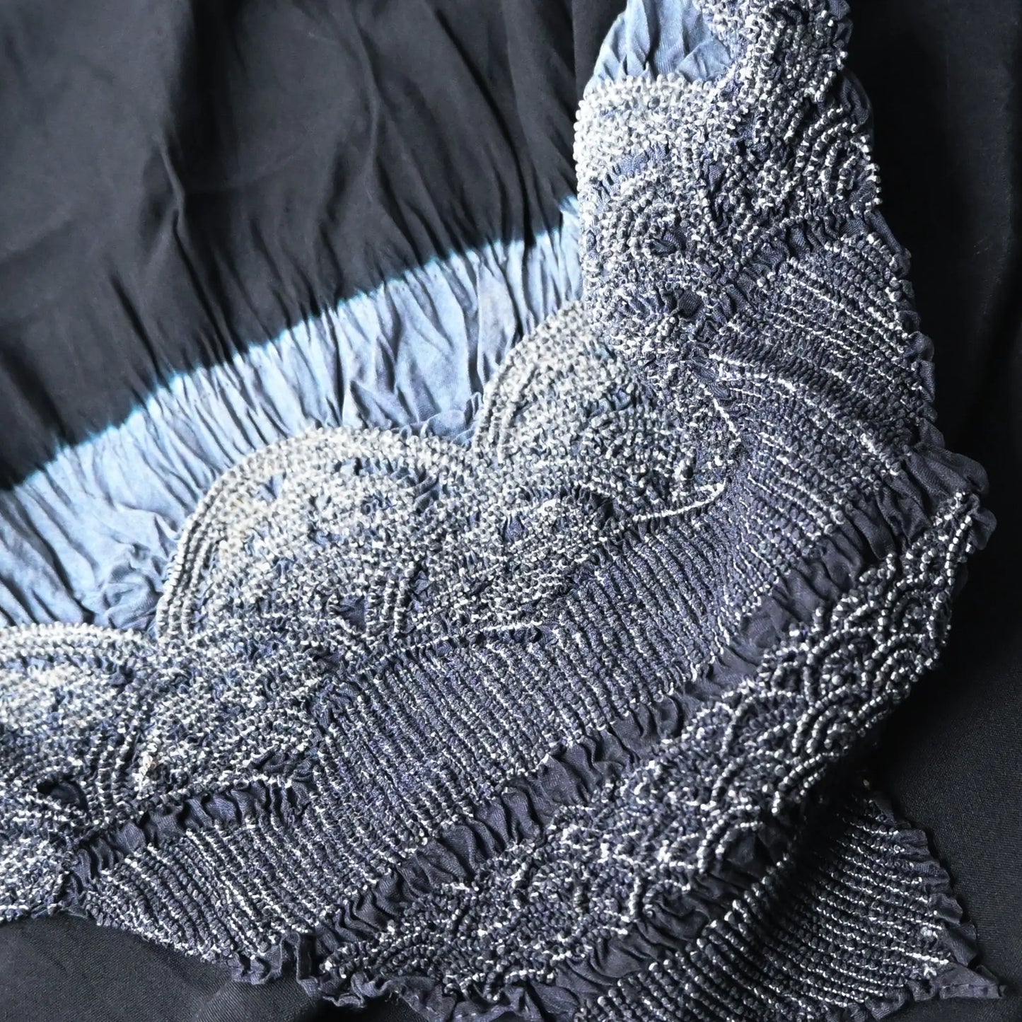 Detailed view of vintage Japanese silk furoshiki with a hand-dyed shibori in dark navy.