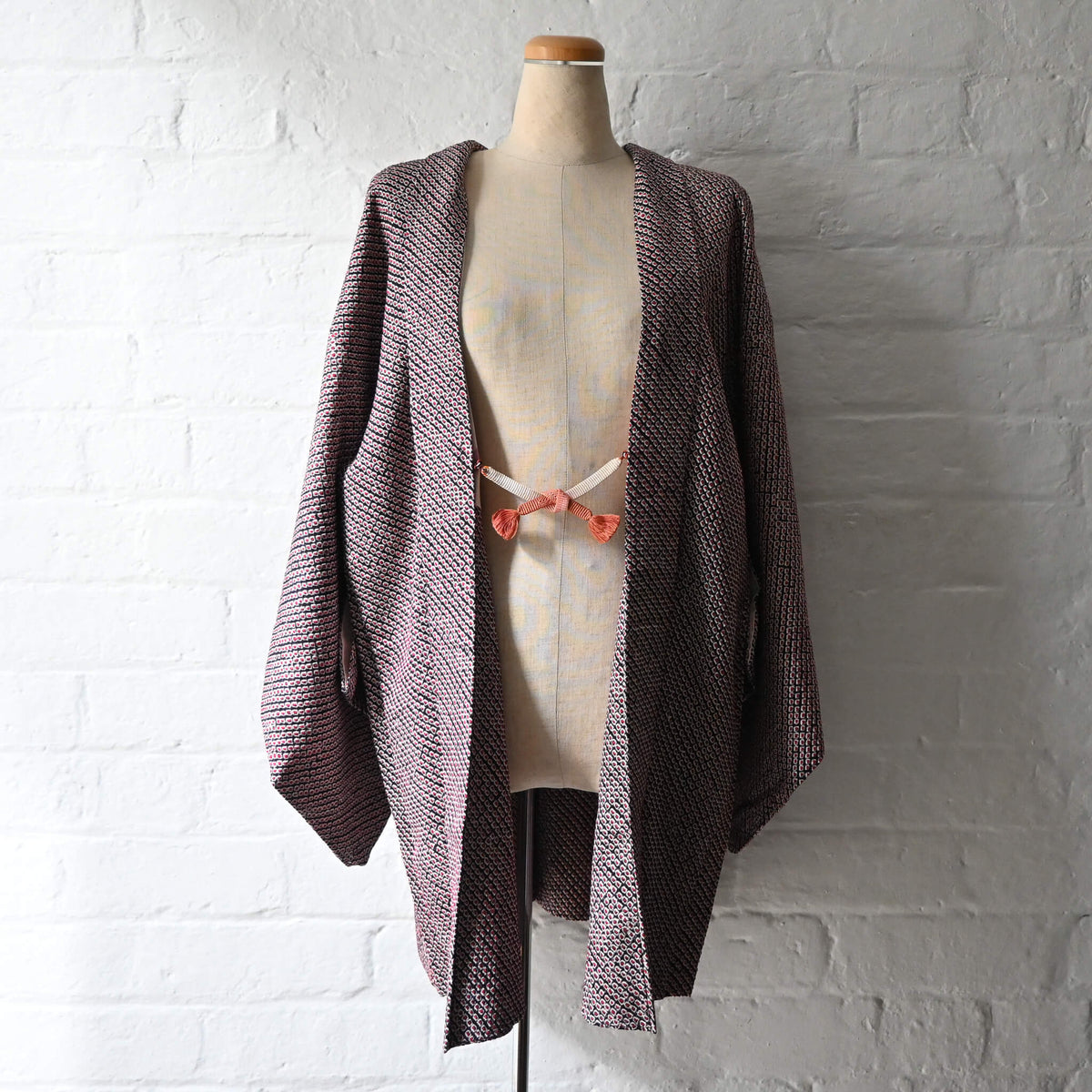Vintage women's silk textured all-over shibori haori in black and red-pink. 