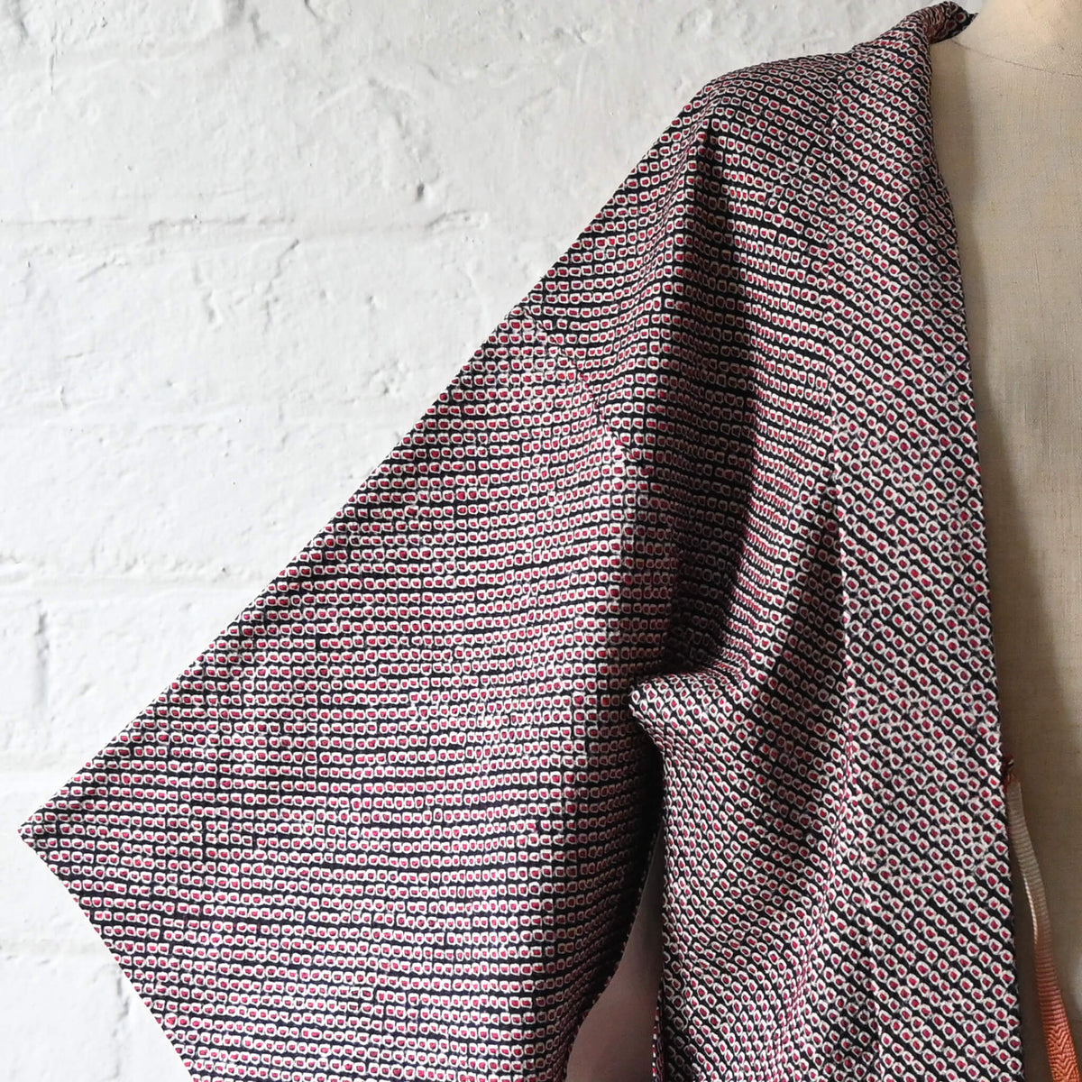 Vintage women's silk textured all-over shibori haori in black and red-pink. 