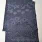 Vintage tsumugi silk kimono fabric with katazome floral arabesque pattern in soft indigo tones.