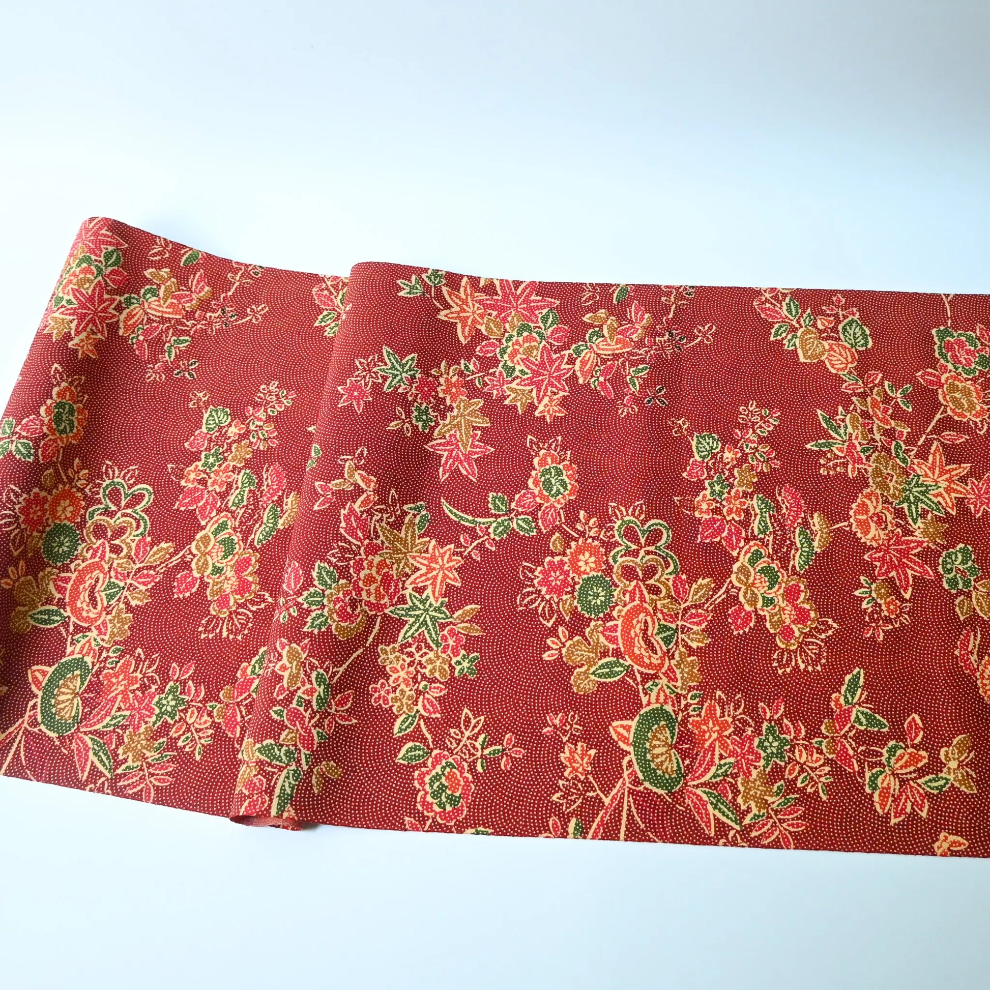 Full view of vintage Japanese silk wool red floral kimono fabric.