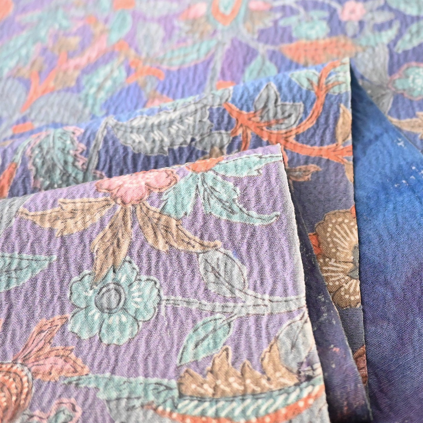 Detailed view of vintage silk wool blend floral kimono fabric, beautiful textured surface.