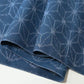 Close-up view of vintage soft blue cotton kimono fabric with Asanoha hemp leaf motif, sold by the metre.