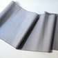 Full view of vintage tsumugi silk kimono fabric sold by the metre in soft grey lilac tone with cross motif.