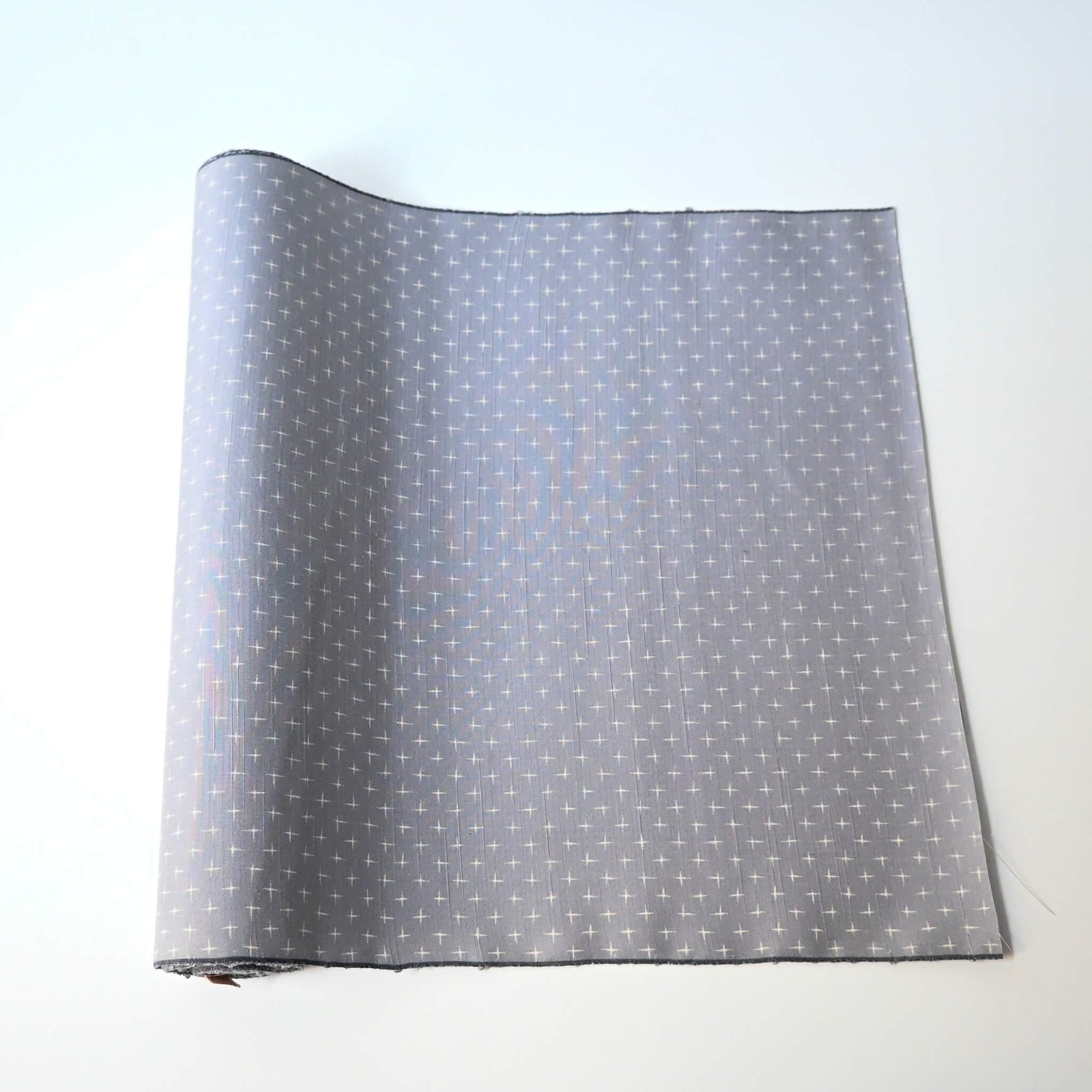 Vintage tsumugi silk kimono fabric sold by the metre in soft grey lilac tone with cross motif.