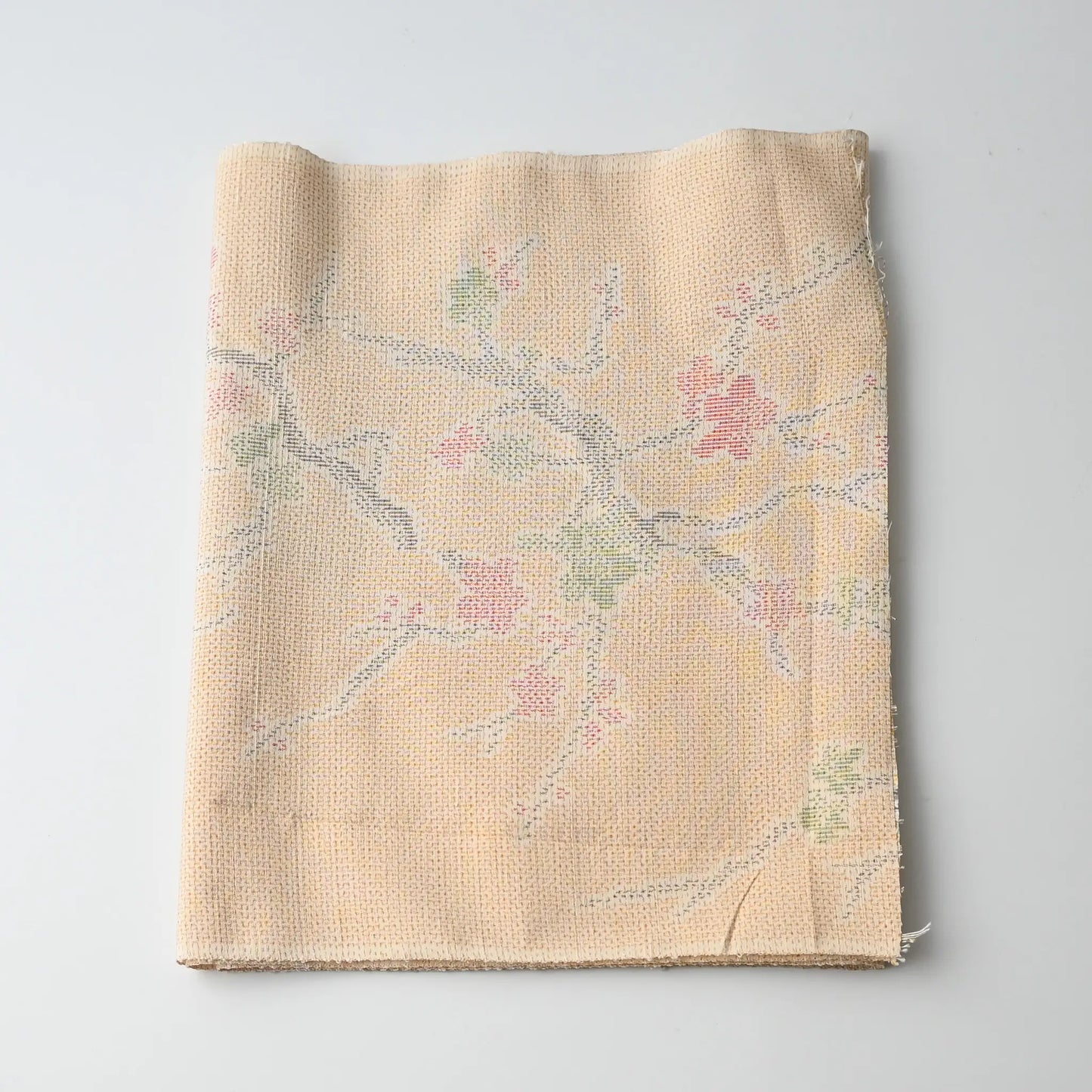 Vintage soft yellow tsumugi kimono silk fabric piece with plum blossom pattern.