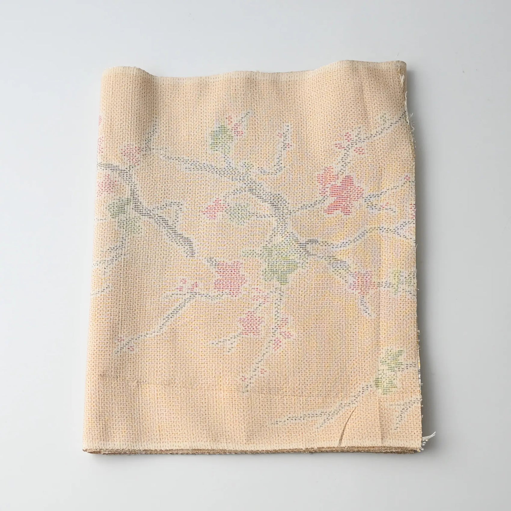Vintage soft yellow tsumugi kimono silk fabric piece with plum blossom pattern.