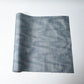 Vintage Japanese tsumugi silk kimono fabric roll in stone blue with sheen.