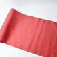 Full view of vintage strawberry red tsumugi silk kimono fabric sold by the metre.