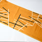 Full view of vintage Japanese Meisen kimono silk piece in striking yellow with black and white line motif from the mid-20th century.