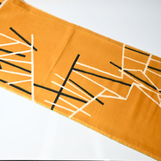 Full view of vintage Japanese Meisen kimono silk piece in striking yellow with black and white line motif from the mid-20th century.