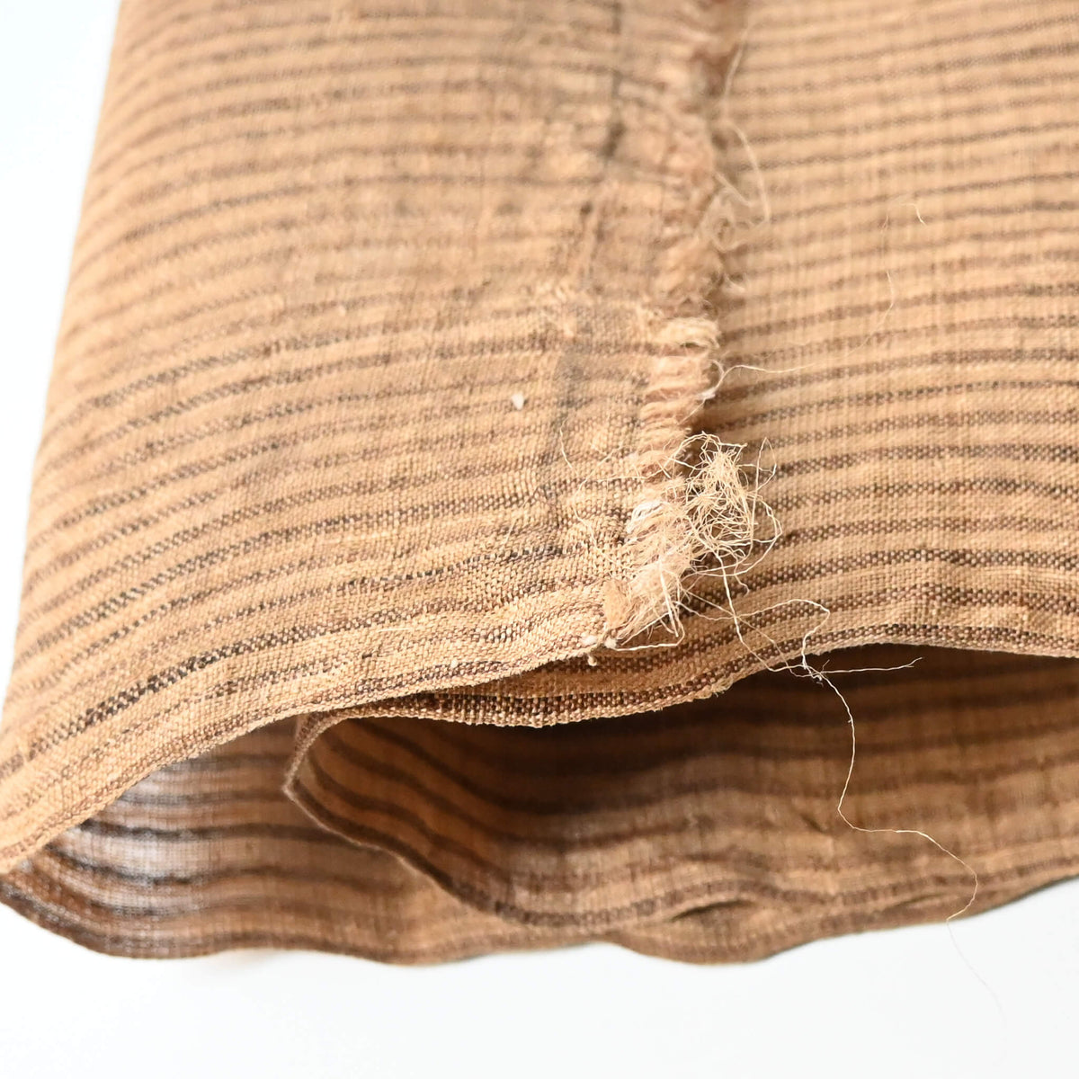 Close-up view of vintage collectable bashofu banana fibre textile, natural brown stripe.