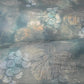 Close-up view of vintage muted teal blue silk Fukure-ori obi with grape vine motif.