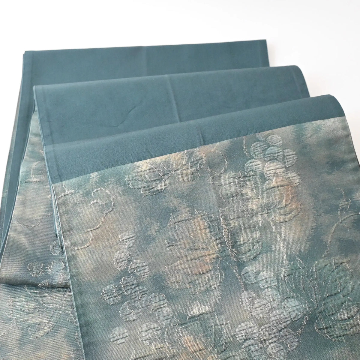 Vintage muted teal blue silk Fukure-ori obi with grape vine motif, sign of use.