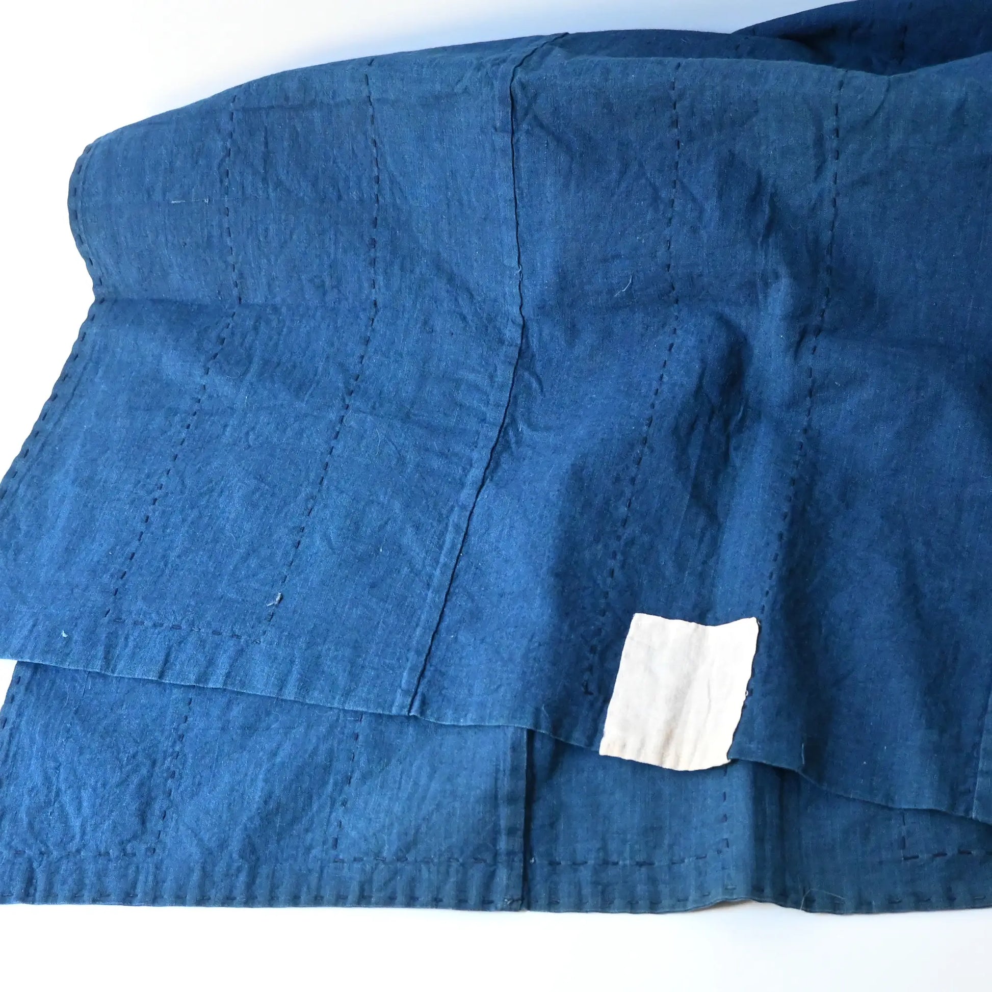 Vintage Japanese three-panel indigo dyed cotton throw with sashiko stitching.