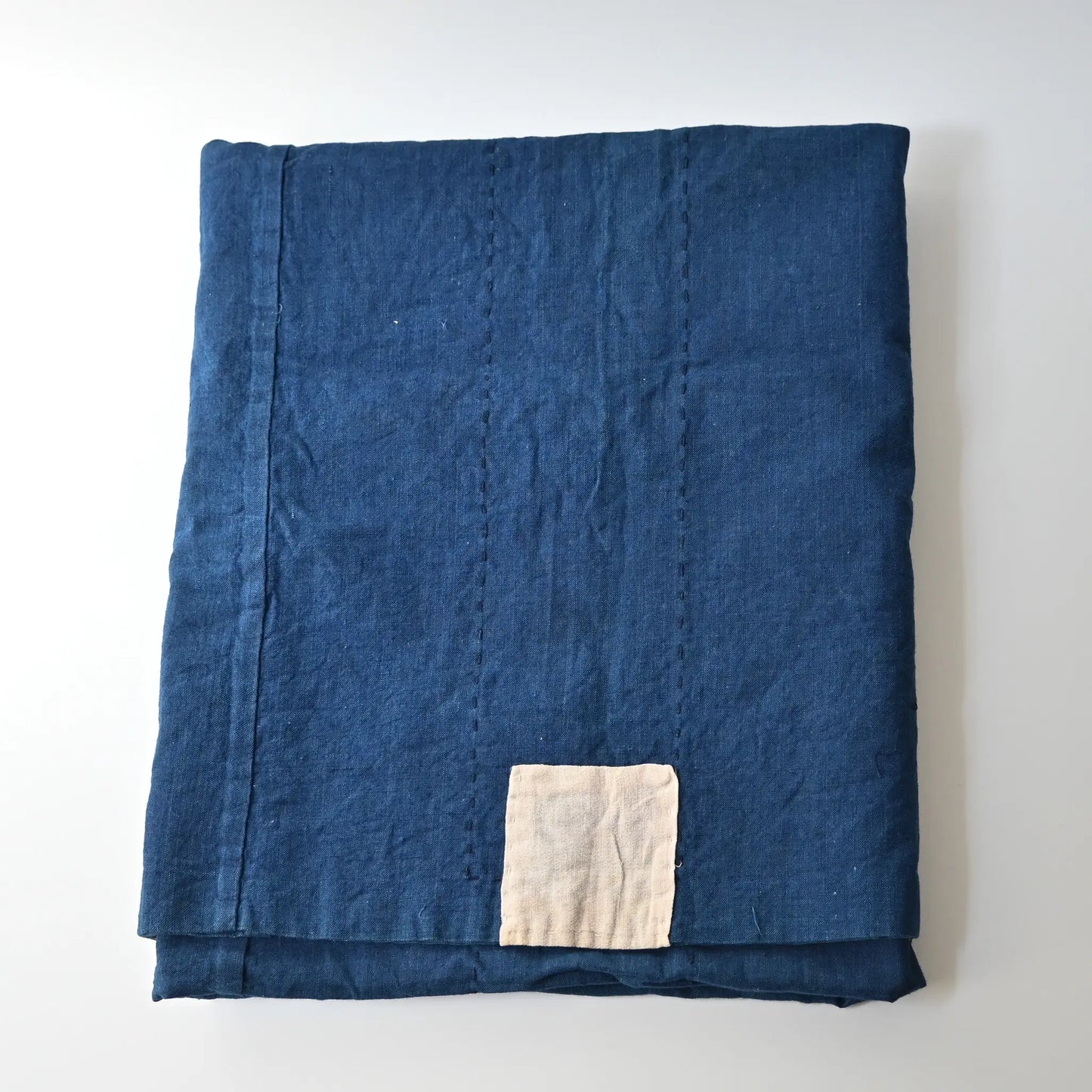 Vintage Japanese three-panel indigo dyed cotton throw with sashiko stitching.