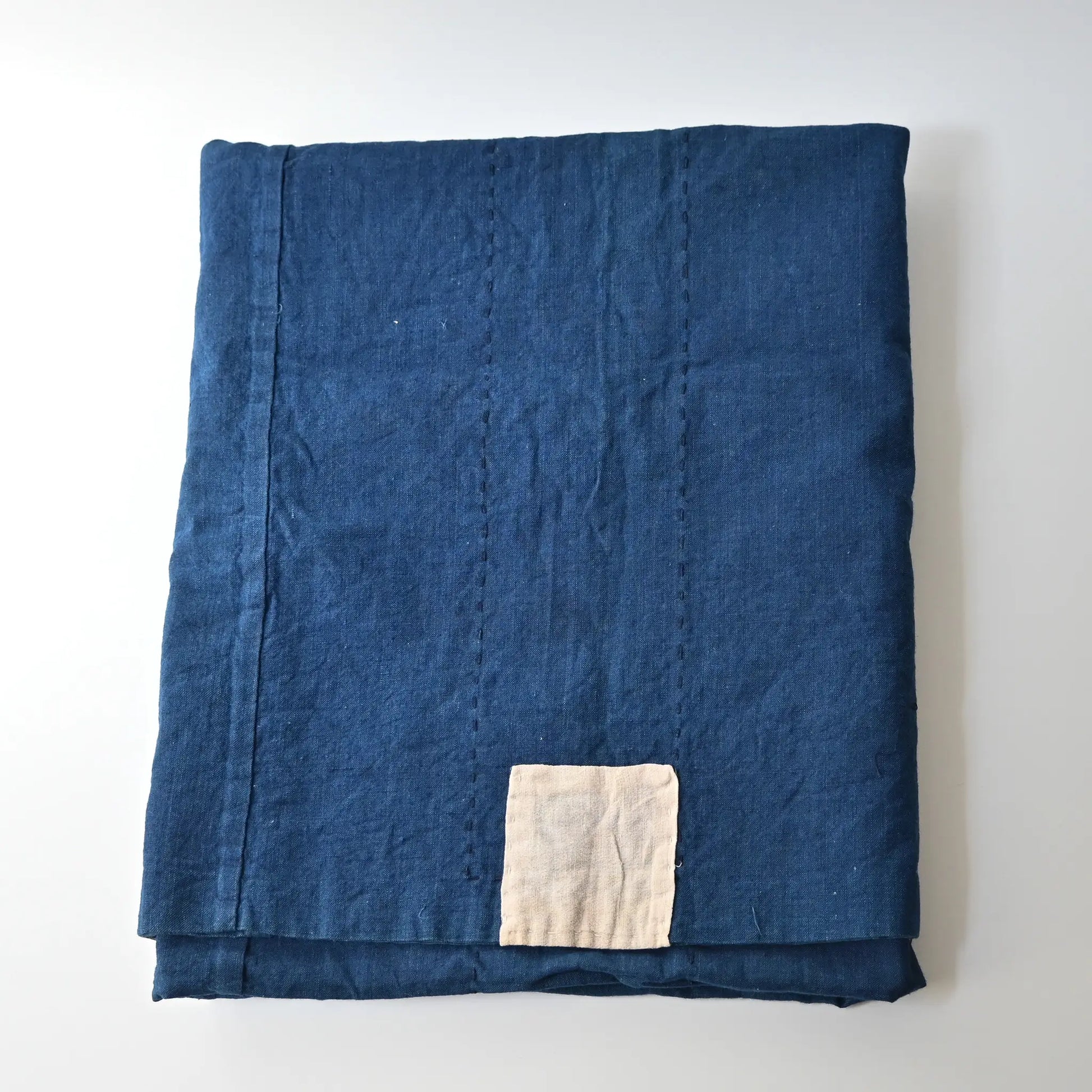 Vintage Japanese three-panel indigo dyed cotton throw with sashiko stitching.