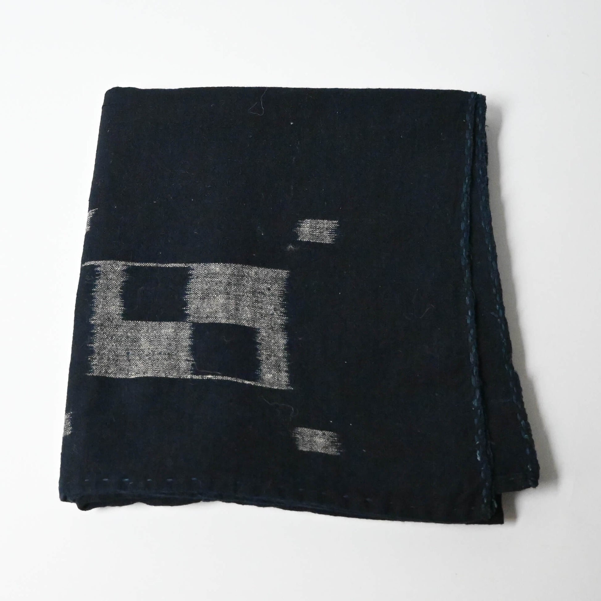 Vintage Japanese three-panel indigo kasuri cotton furoshiki with simple and understated design.