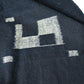Close-up view of vintage Japanese three-panel indigo kasuri cotton furoshiki with simple and understated design.