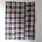 Full view of vintage three-panel indigo plaid check cotton piece from the mid-20th century.
