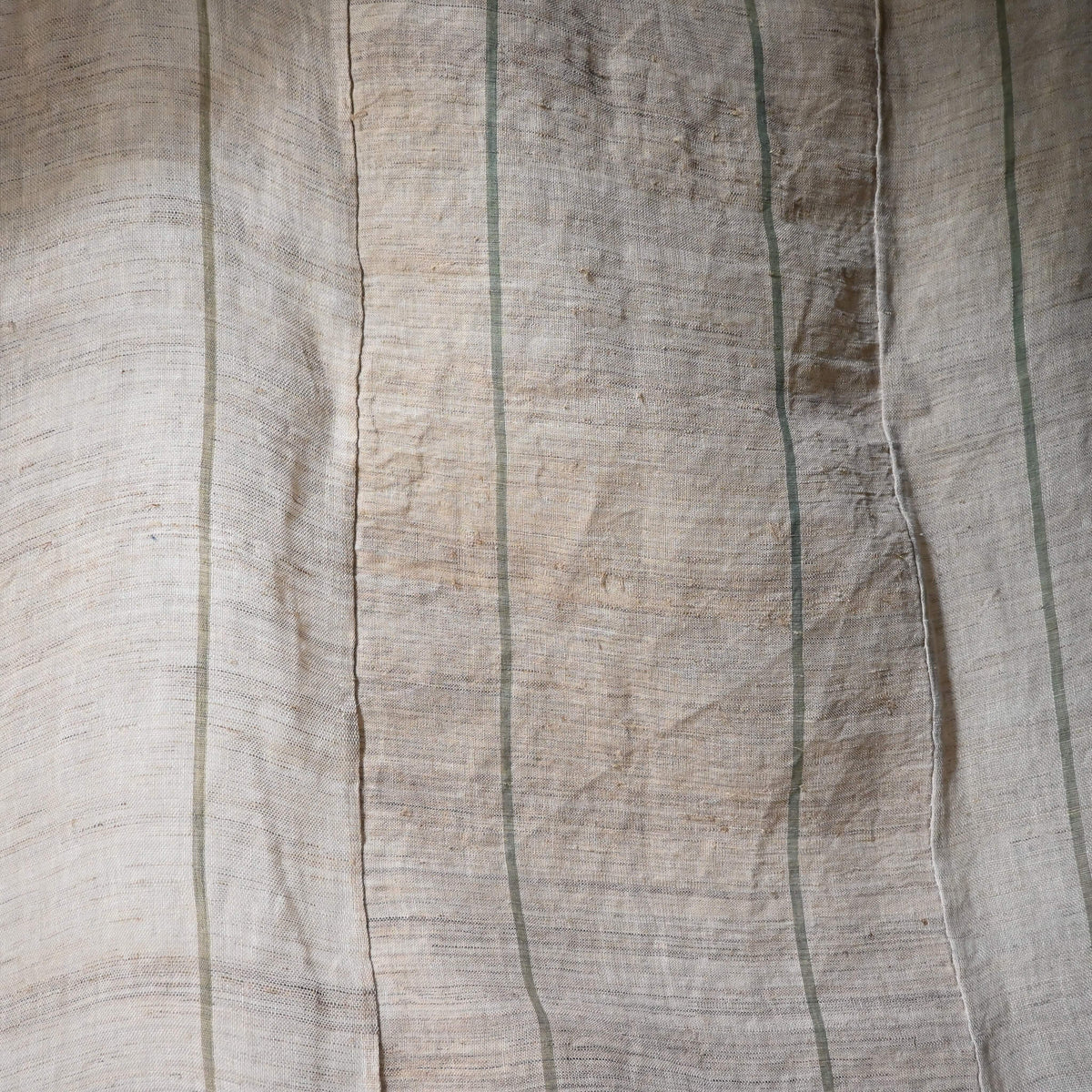 Detail of vintage three-panel mosquito net kaya hemp, natural with green stripes design.