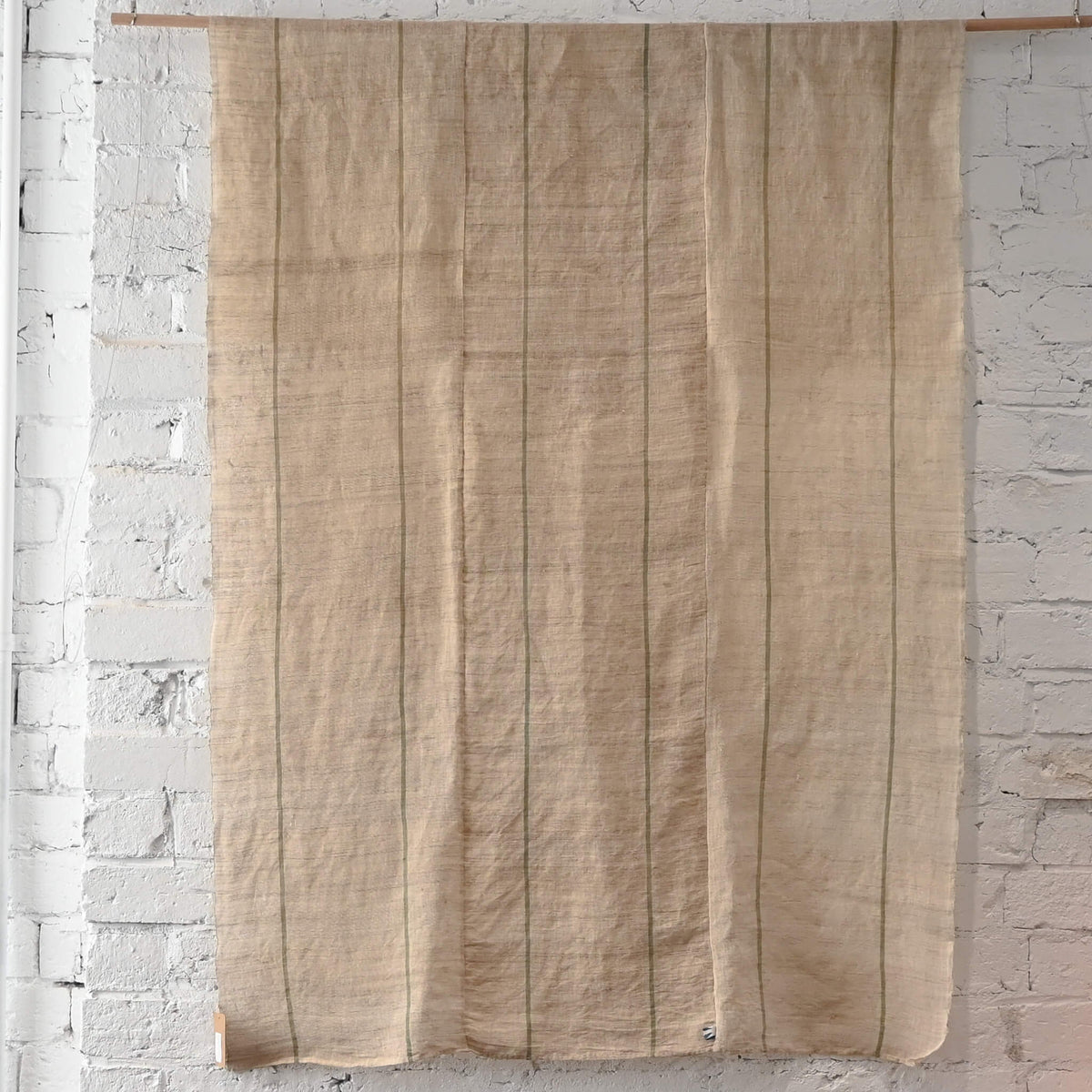 Full view of vintage three-panel mosquito net kaya hemp, natural with green stripes design.