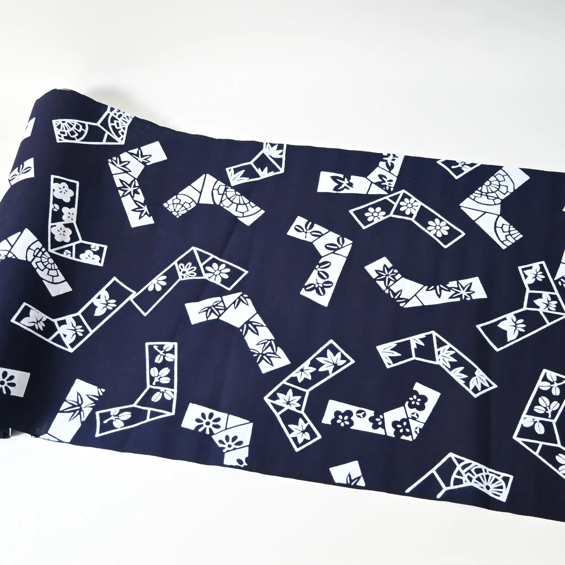 Vintage traditional yukata fabric rol with playful knot motifs filled with seasonal flowers.