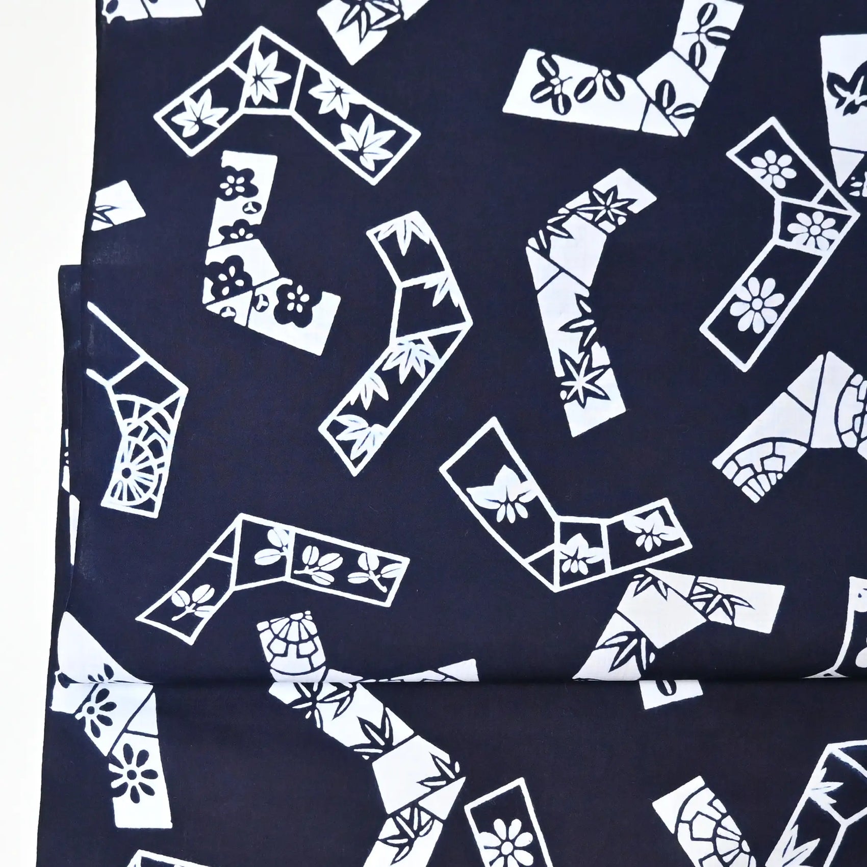 Vintage traditional yukata fabric rol with playful knot motifs filled with seasonal flowers.