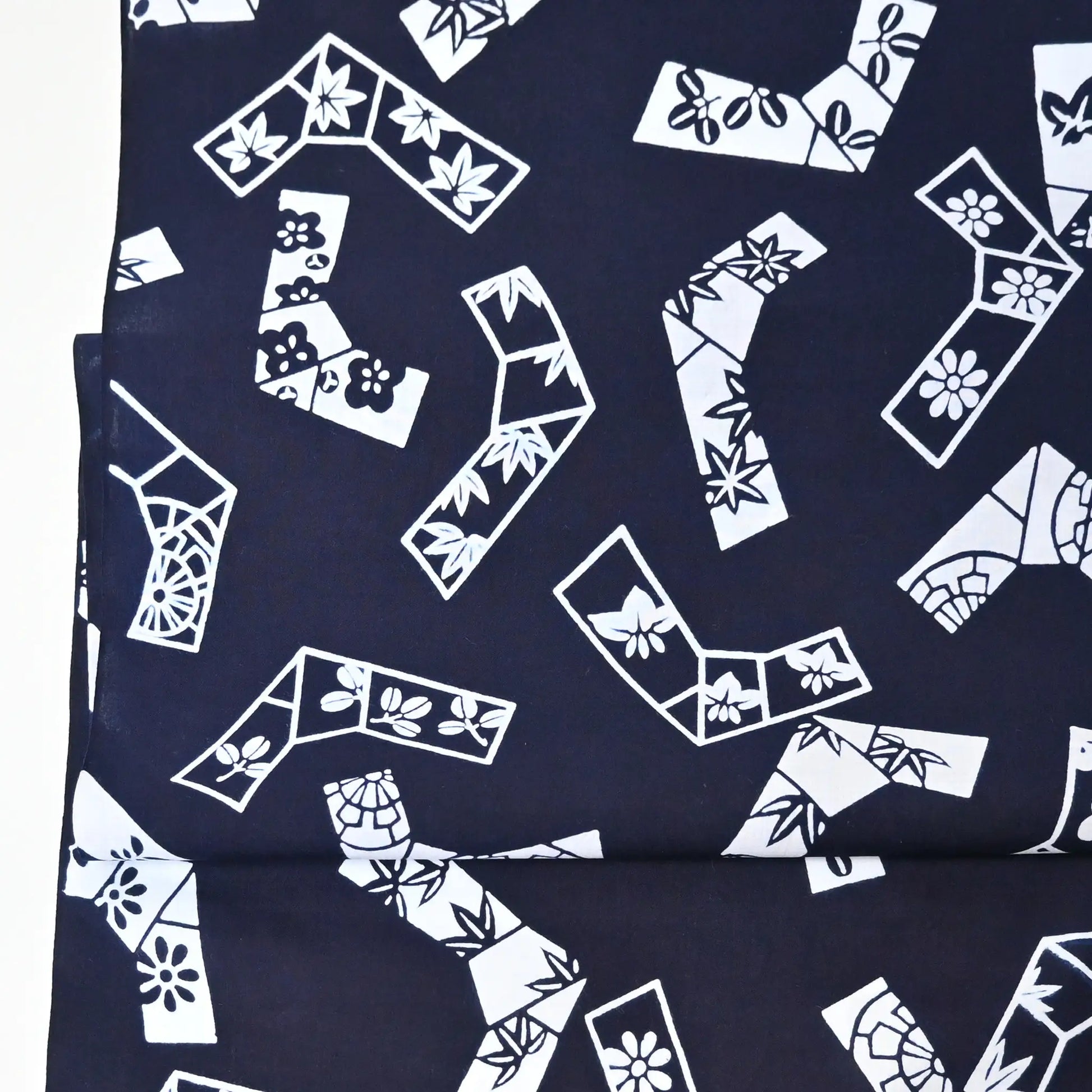 Vintage traditional yukata fabric rol with playful knot motifs filled with seasonal flowers.